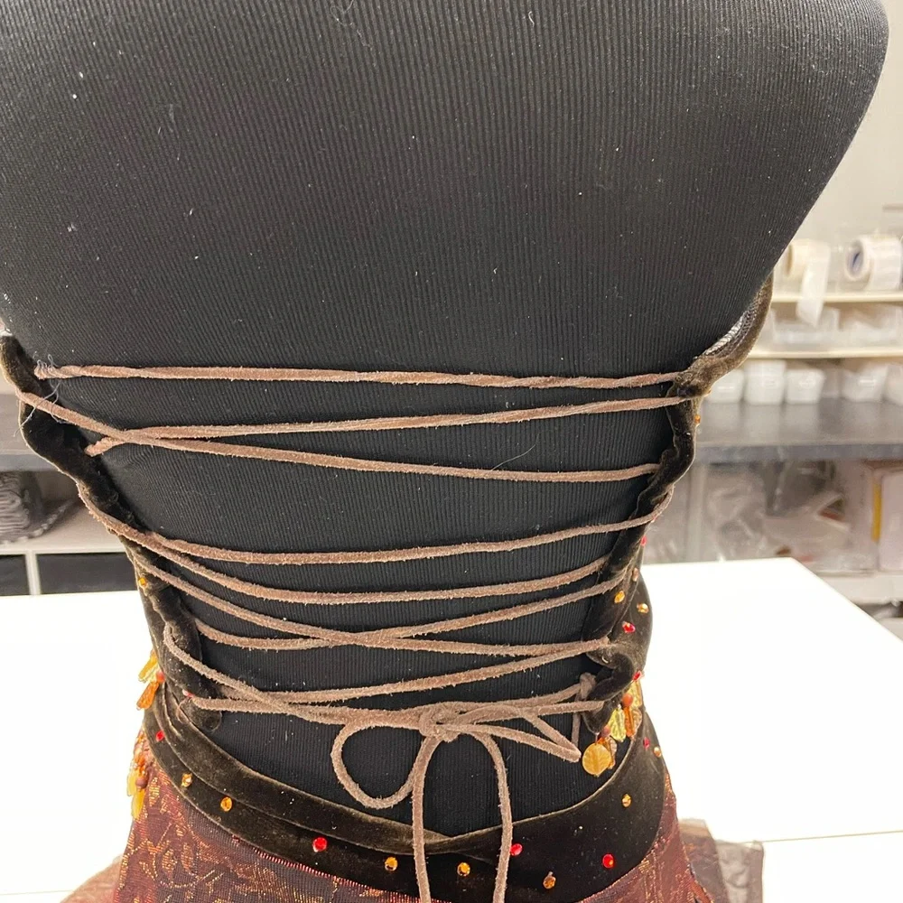 The line up brown velour dance costume rhinestones. Beaded trim.